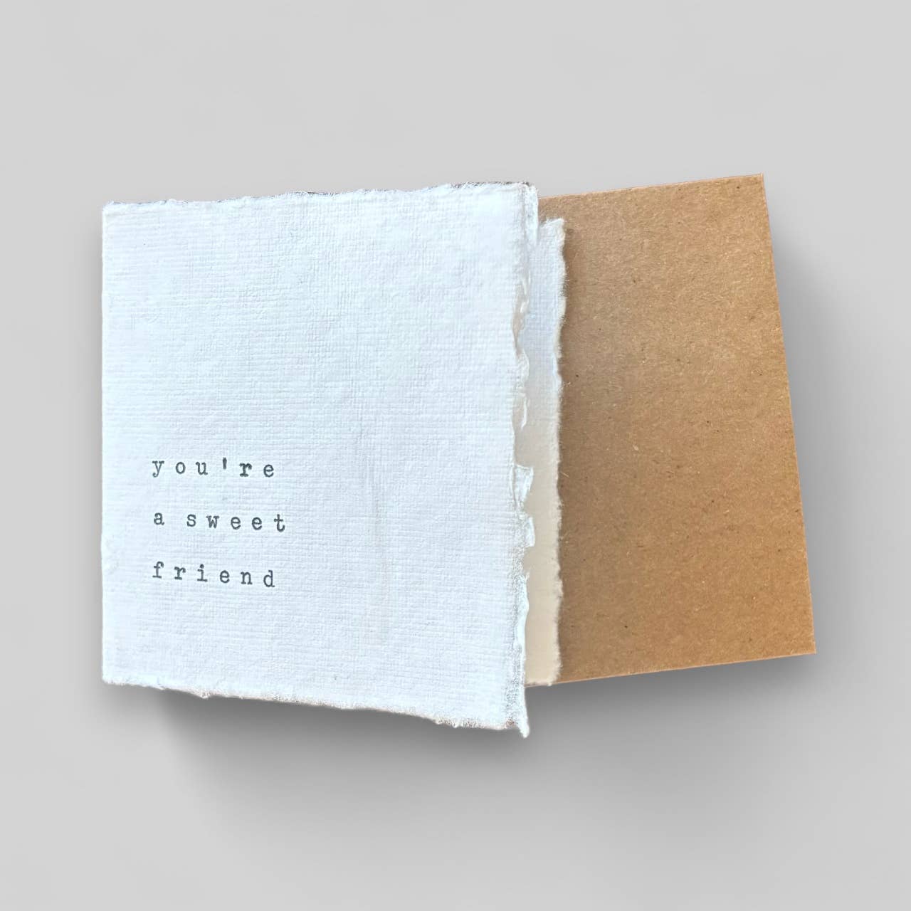 Small white handmade typewritten friend card